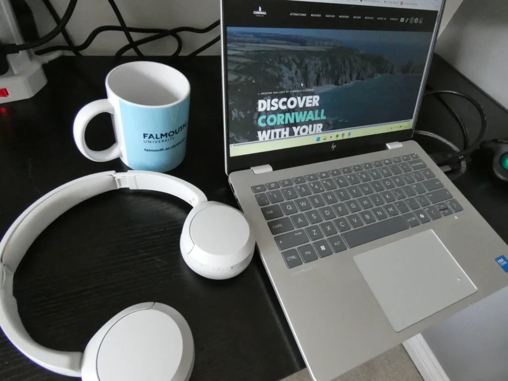 Cornwall web developer laptop and headphones workspace